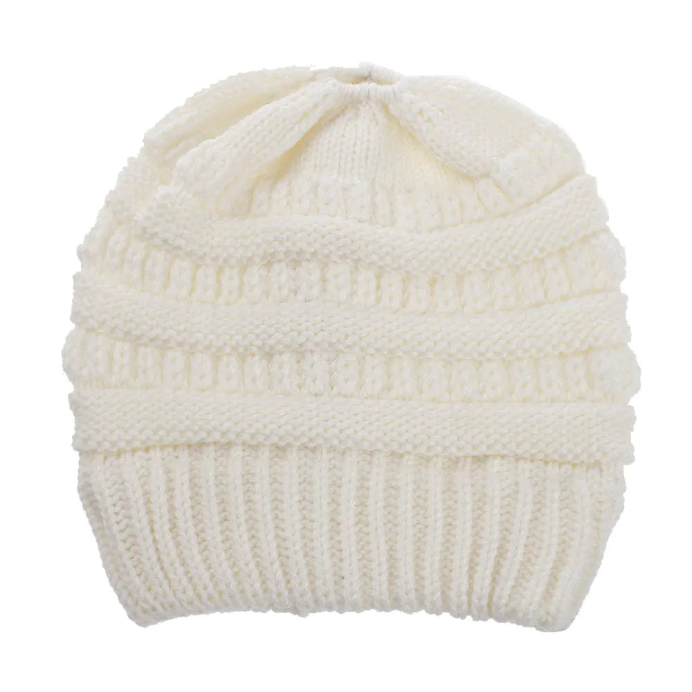 White Soft Knit Ponytail Beanie. Shop Winter Hats on Mounteen. Worldwide shipping available.