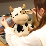 Cute & Cozy Cow Stuffed Animal Hugging Plush. Shop Stuffed Animals on Mounteen. Worldwide shipping available.