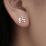 Dainty Silver Bicycle Earrings. Shop Earrings on Mounteen. Worldwide shipping available.