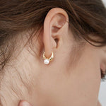 Mini Hoop & Pearl Huggie Earring Set. Shop Earrings on Mounteen. Worldwide shipping available.