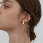 Mini Hoop & Pearl Huggie Earring Set. Shop Earrings on Mounteen. Worldwide shipping available.