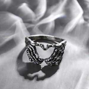 Realistic Silver Skull Hand Heart Ring. Shop Jewelry on Mounteen. Worldwide shipping available.
